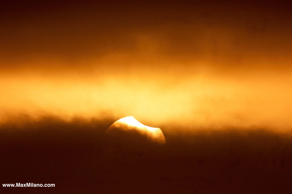 The Moon taking a bite out of the sun on its way out of totality as the sea fog rolls in. La Serena, Chile Eclipse 2019. Pic by Max Milano.